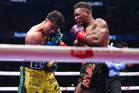 Christian Mbilli, right, connects with a right hand on Lester Martinez during their undercard bout.