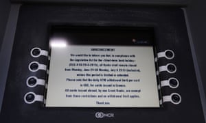 A bank message is seen on ATM’s screen in Athens.