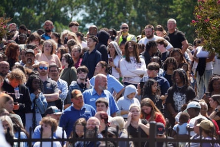 Crowd of people on bleachers.