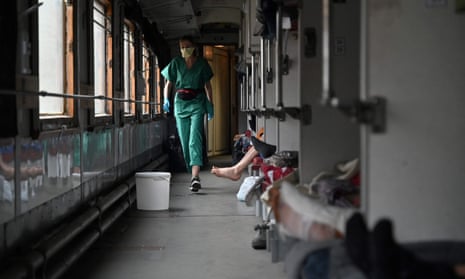 Elena, 33, an MSF team member, cares for patients on the medical evacuation to Lviv.