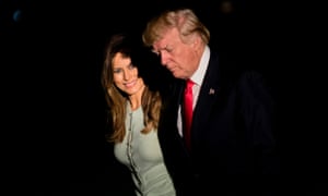 Donald and Melania Trump walk to the White House on Saturday night after returning from a nine-day trip abroad.