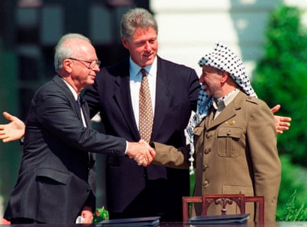 The Israeli prime minister Yitzhak Rabin, left, and the Palestinian leader Yasser Arafat with US president Bill Clinton at the signing of the peace accord between Israel and the Palestinians in 1993.