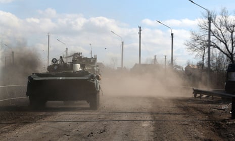 A Ukrainian armoured personnel carrieron a road outside Bakhmut.
