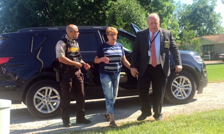 Sue Hodgkinson, under escort with the St Clair county sheriff’s office.
