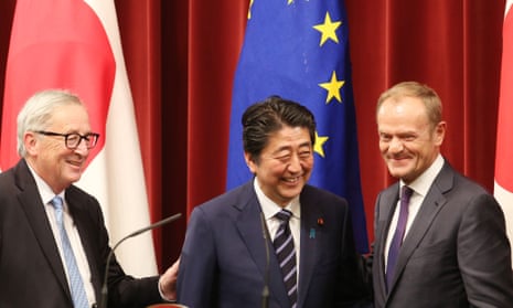 Jean-Claude Juncker (left), Shinzo Abe (centre) and Donald Tusk at a joint press conference in Tokyo