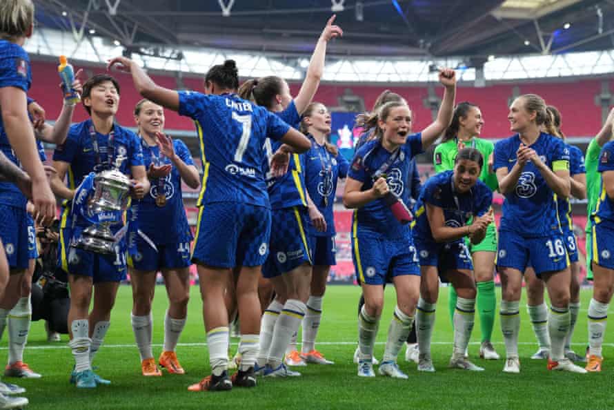 Chelsea players celebrate with the Trophy.