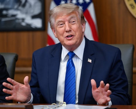 Donald Trump speaks to reporters at a cabinet meeting at Camp David, Maryland.