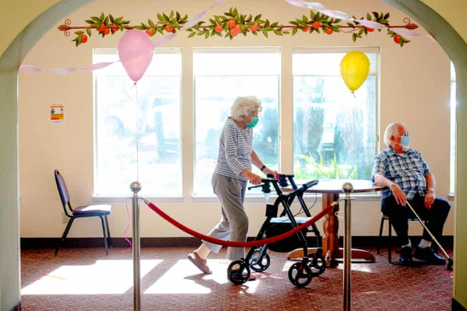 Seniors wait for their turn to receive their dose of Pfizer vaccine at the Mission Commons, a senior living community, in Redlands, California.