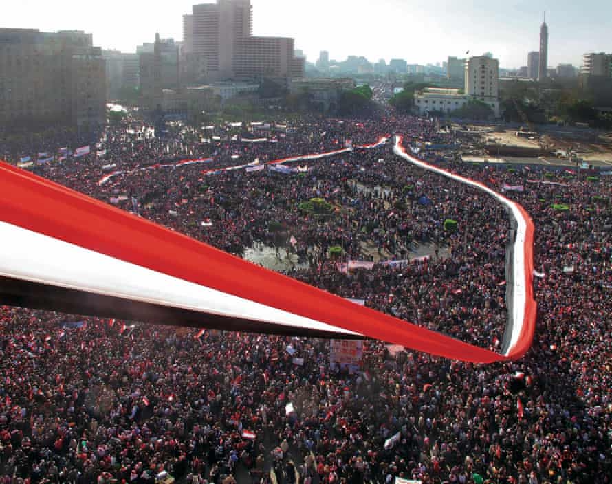 Red, white and black striped fabric stretched out over crowds filling Tahrir Square, Cairo, Egypt, on 18 February 2011, the “Friday of Victory”, a week after President Hosni Mubarak was toppled