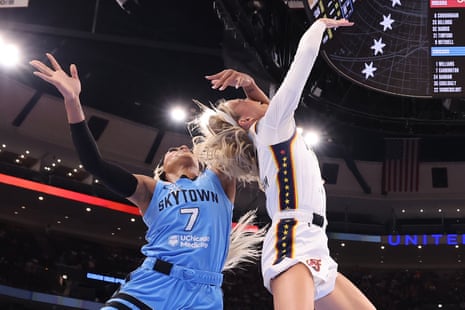 Indiana’s Sophie Cunningham is fouled by Chicago’s DiJonai Carrington during the first half of Saturday’s game at the United Center in Chicago.