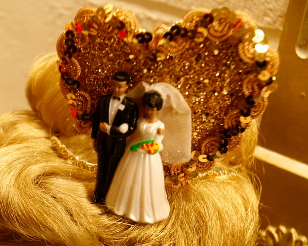 Old-fashioned topper on a wedding cake