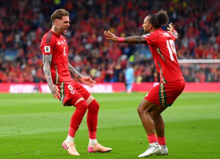 Joe Rodon is congratulated by Sorba Thomas after giving Wales the lead