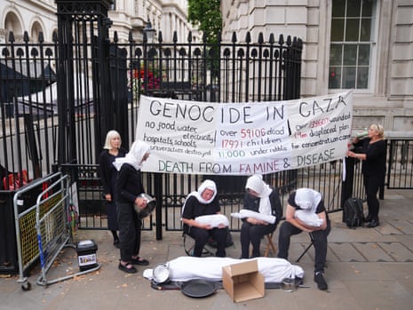 Pro-Palestine protesters taking part in a demonstration outside Downing Street today, where the cabinet will soon be meeting to discuss Gaza.