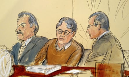 Keith Raniere, center, seated between his attorneys during the first day of his trial on 7 May.