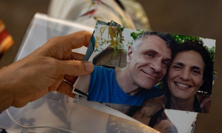 Alessandra Sampaio holds a photograph of herself and her late husband, Dom Phillips.