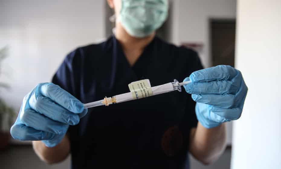A healthcare worker with a syringe of the vaccine developed by Pfizer and BioNTech at a hospital in  Ankara, Turkey in October.