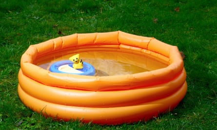 A child’s paddling pool with a toy inside