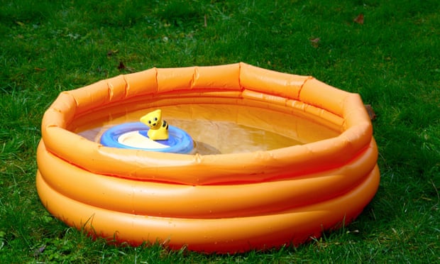 A child's paddling pool with a toy inside