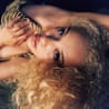 Jorja Smith lying down lokoing at the camera
