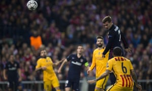 Atlético’s Antoine Griezmann, right, heads the ball past Barcelona’s goalkeeper Marc-Andre ter Stegen.