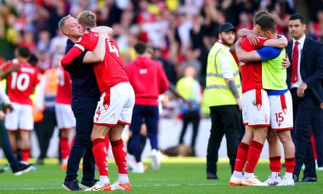 Steve Cooper hugs Joe Worrall at the final whistle as Nottingham Forest celebrate Premier League survival