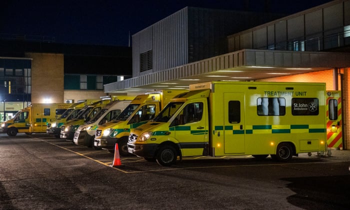 Ambulances at the entrance to the emergency department with patients awaiting to be admitted, at Antrim Area hospital in Northern Ireland.