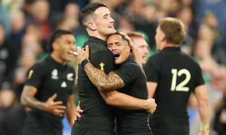 Will Jordan and Aaron Smith of New Zealand embrace
