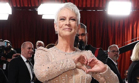 jamie lee curtis makes heart sign with hands