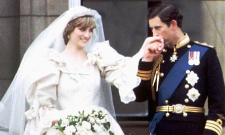 Charles kissing Diana’s hand on the balcony of Buckingham Palace on their wedding day.
