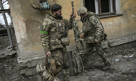 Ukrainian servicemen prepare to join the front line near Bakhmut in the Donbas region.
