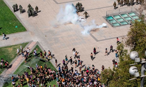 Riot police use tear gas against protestors in Santiago, Chile.