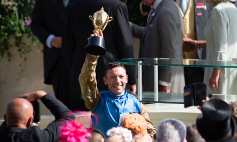 Frankie Dettori holds up the Gold Cup after victory on Courage Mon Ami on Thursday.