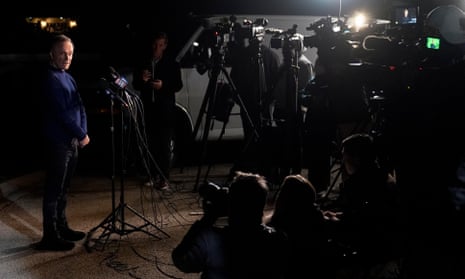 Uri Raanan, left, talks to reporters outside his Illinois home after the hostages’ release