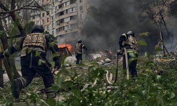 Emergency services fight a fire following a Russian air strike near Kharkiv.