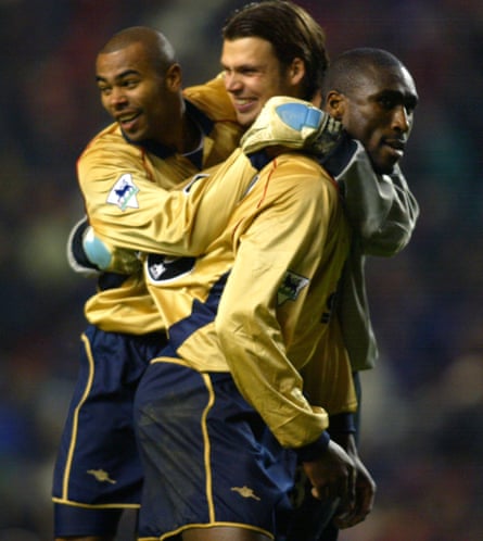 Ashley Cole, Stuart Taylor and Sol Campbell celebrate as the full-time whistle goes.