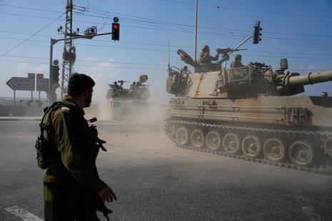 Israeli army tanks move towards the Gaza Strip border in southern Israel
