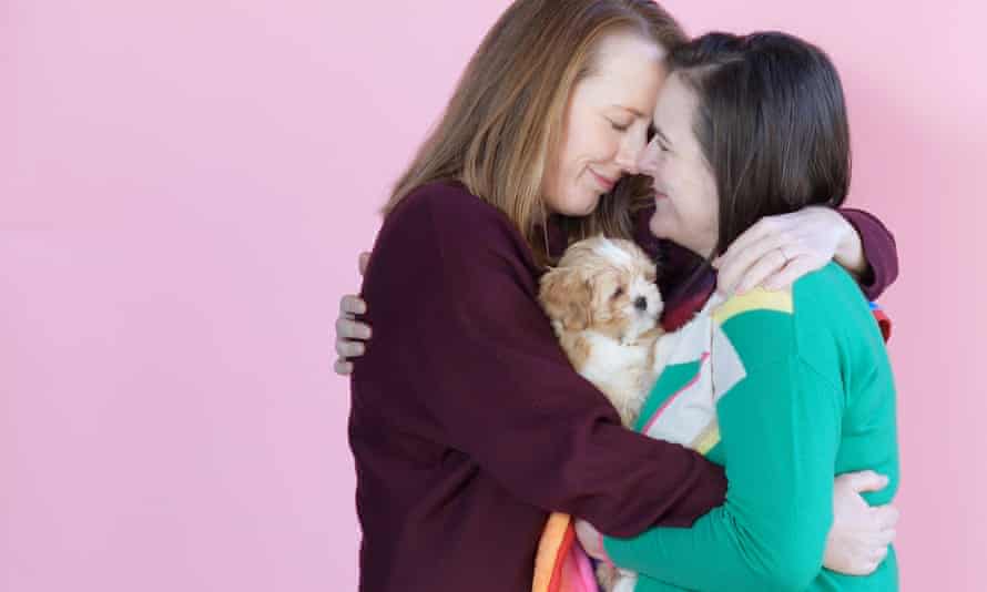 Rachel and Kerry Howells-Brewer and Rainbow the pup, London