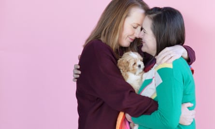 Rachel and Kerry Howells-Brewer and Rainbow the pup, London