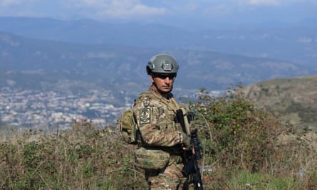 An Azeri serviceman stands at a former Armenian separatists’ military position in the village of Mukhtar on 3 October 2023.