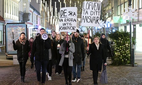 People march with placards during a demonstration against rape in Malmo, Sweden, 19 December 2017.