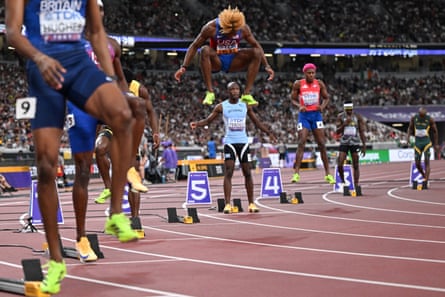 Lyles warms up before the men's 200m final