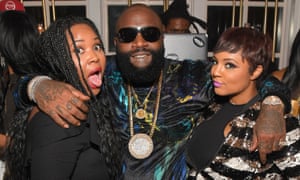 Rick Ross with guests at a beauty industry launch party