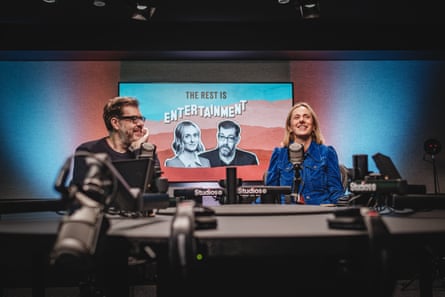 Marina Hyde laughing as Richard Osman smiles at her in a recording studio