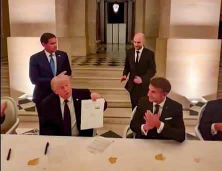 Donald Trump and Emmanuel Macron during the signing of a deal with Iran to end the Middle East war
