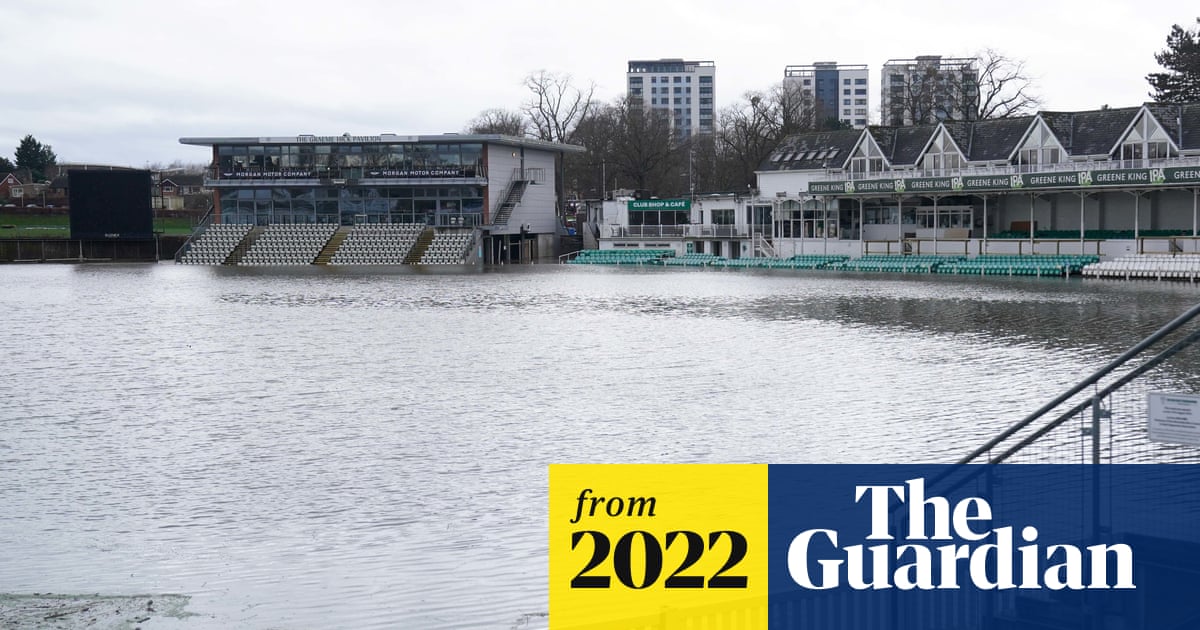 A flooded local cricket ground in the United Kingdom with water covering the pitch.