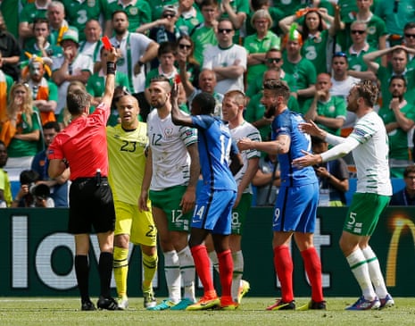 Referee Nicola Rizzoli shows the red card.