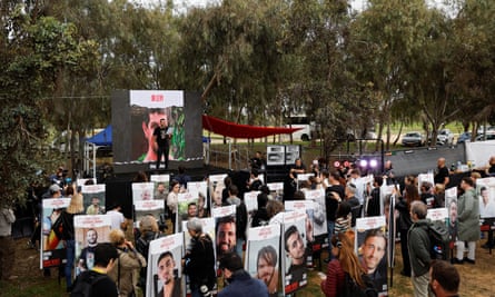 Family members of hostages hold a press conference at the site of the festival.