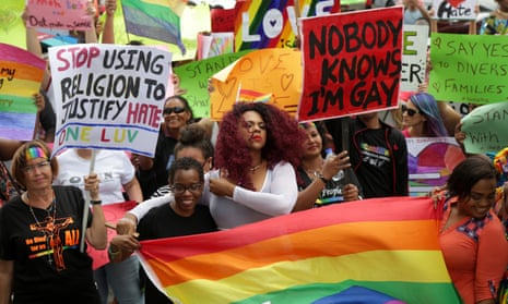 Members of the LGBT community demonstrate outside the hall of justice in Port of Spain, Trinidad and Tobago on 12 April.