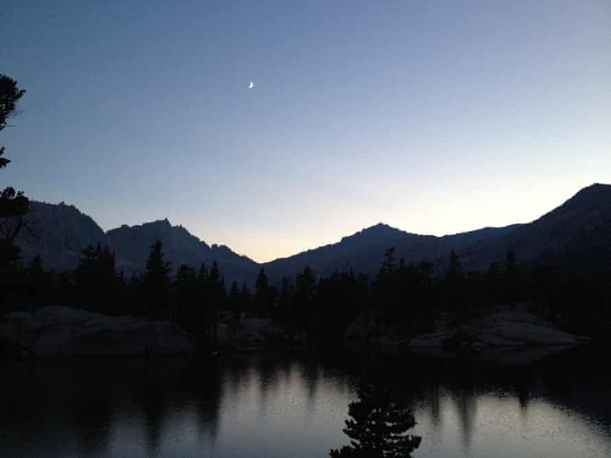 View of the Sierras from Sequoia national park with the moon high in the sky.