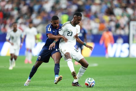 Mohamed Kanno is held up by Deroy Duarte.